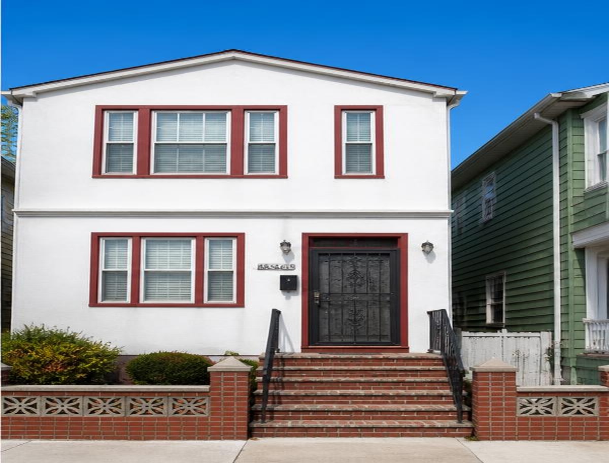 After — stucco house exterior in Queens, NY